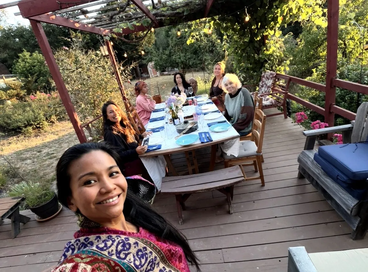 Shared meal on the garden deck at sunset